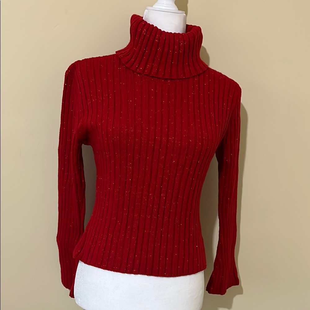 Red turtleneck knitted with red sparkle thread. Fits a small-medium.